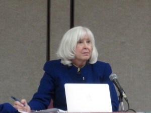 CPUC Representative Denise Tyrrell, taking notes,  listens to nearly 60 speakers opposed to the power plants. Only one in favor of Quail Brush.